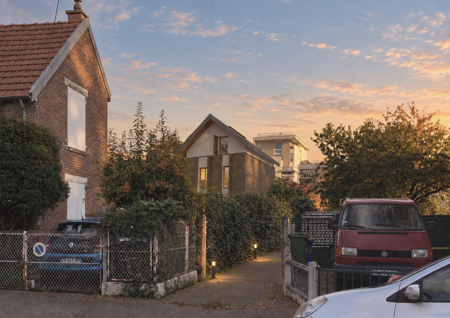 Insertion paysagère : une maison contemporaine intégrée dans une photographie de rue pavillonnaire, entre les constructions existantes.